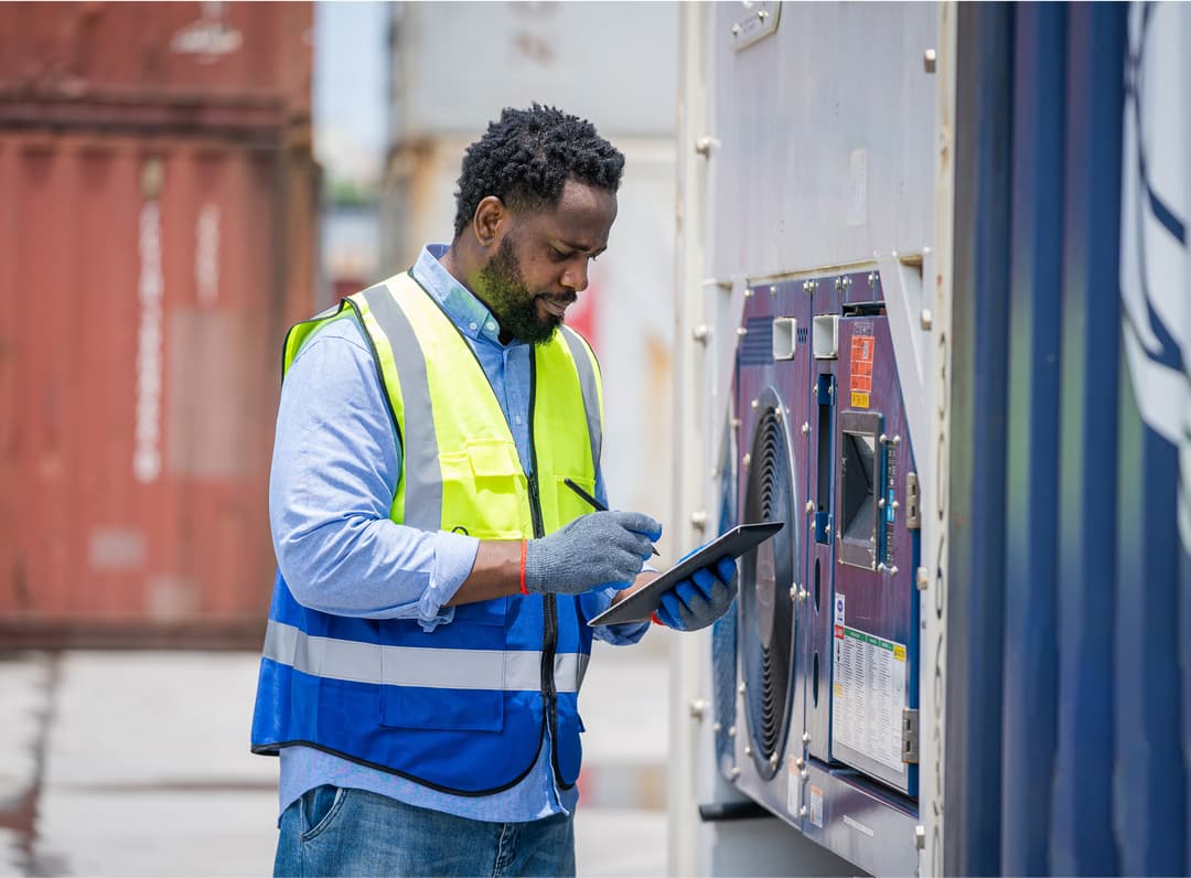 ASAD worker in safety vest inspecting equipment
